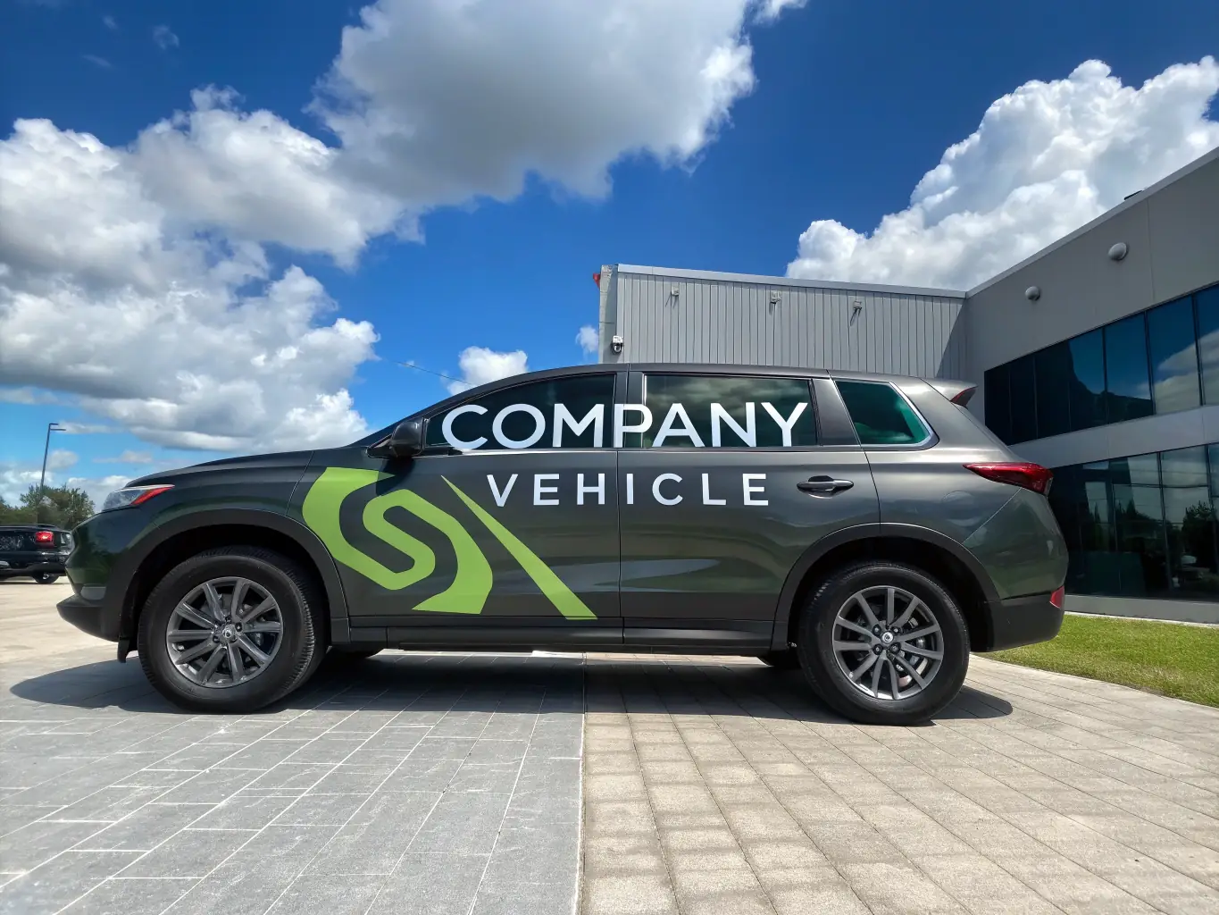 An image of a Precision Lawn & Garden Care LLC truck parked in front of a well-maintained commercial property in Ocoee, Florida, emphasizing their reliability and professionalism.